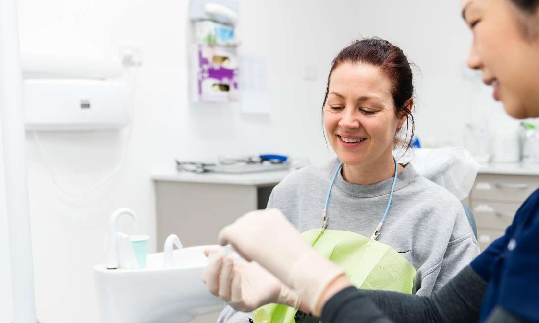 Dr Queenie of APlus with a patient